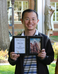 Molei Tao holding his College of Sciences Faculty Development Award during the 2022 Spring Sciences Celebration.