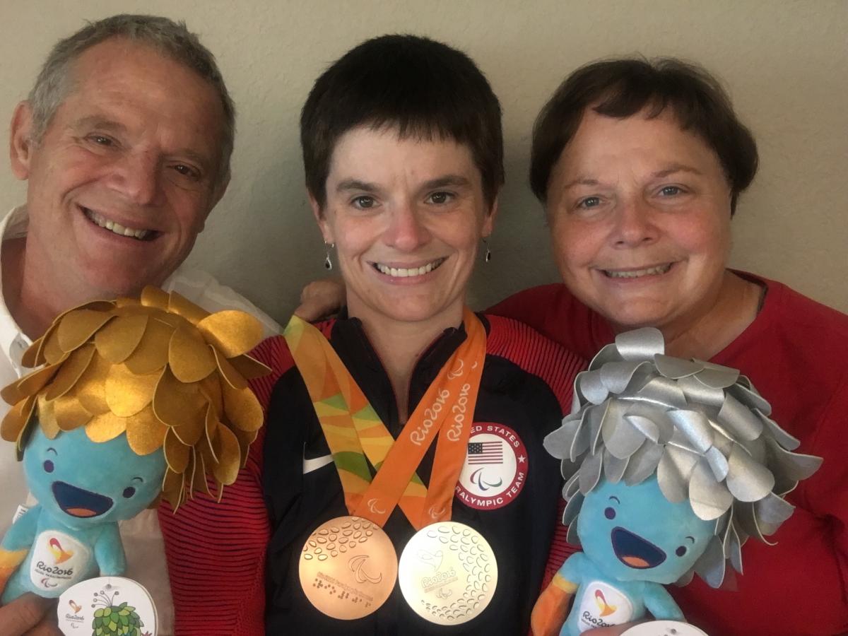 Mitchell with her parents in Rio de Janeiro at the 2016 Paralympic Games. 